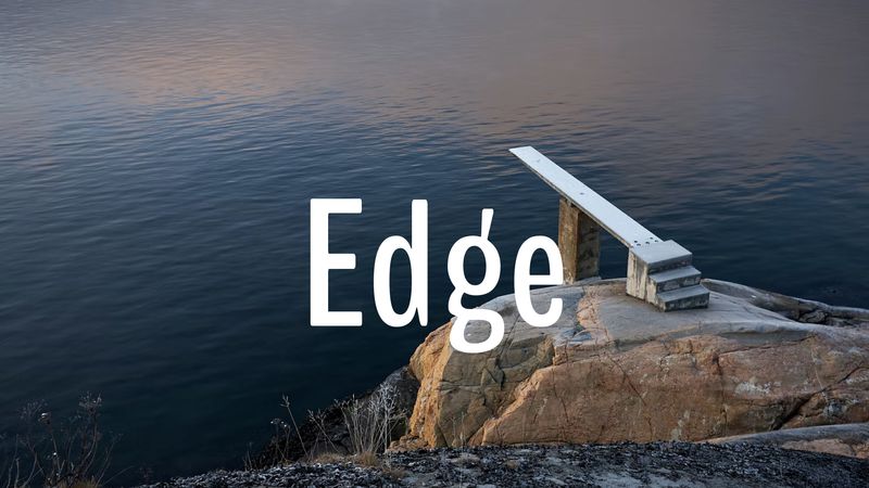 A large “Edge” text on a background of a diving board over a lake